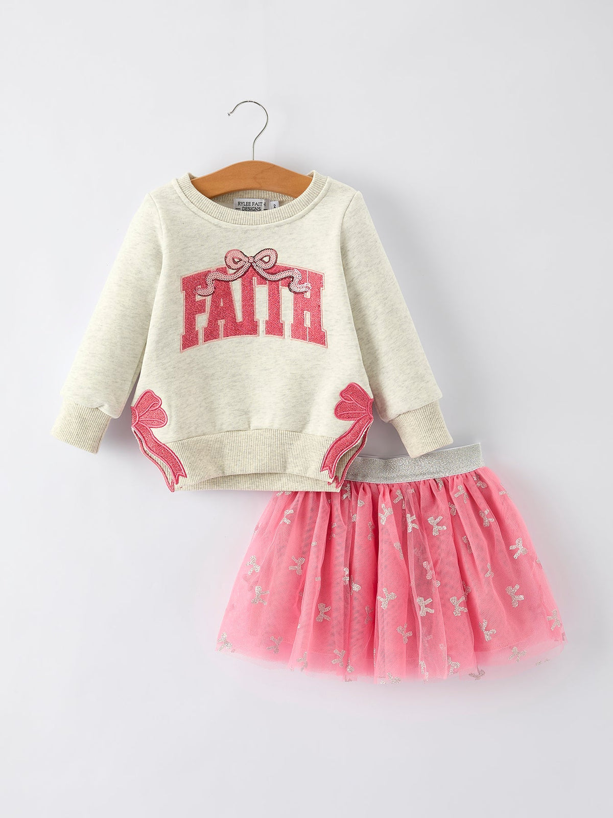 a sweater and tutu on a swinger