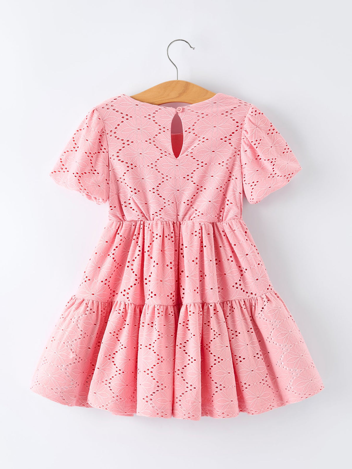 a pink dress on a swinger
