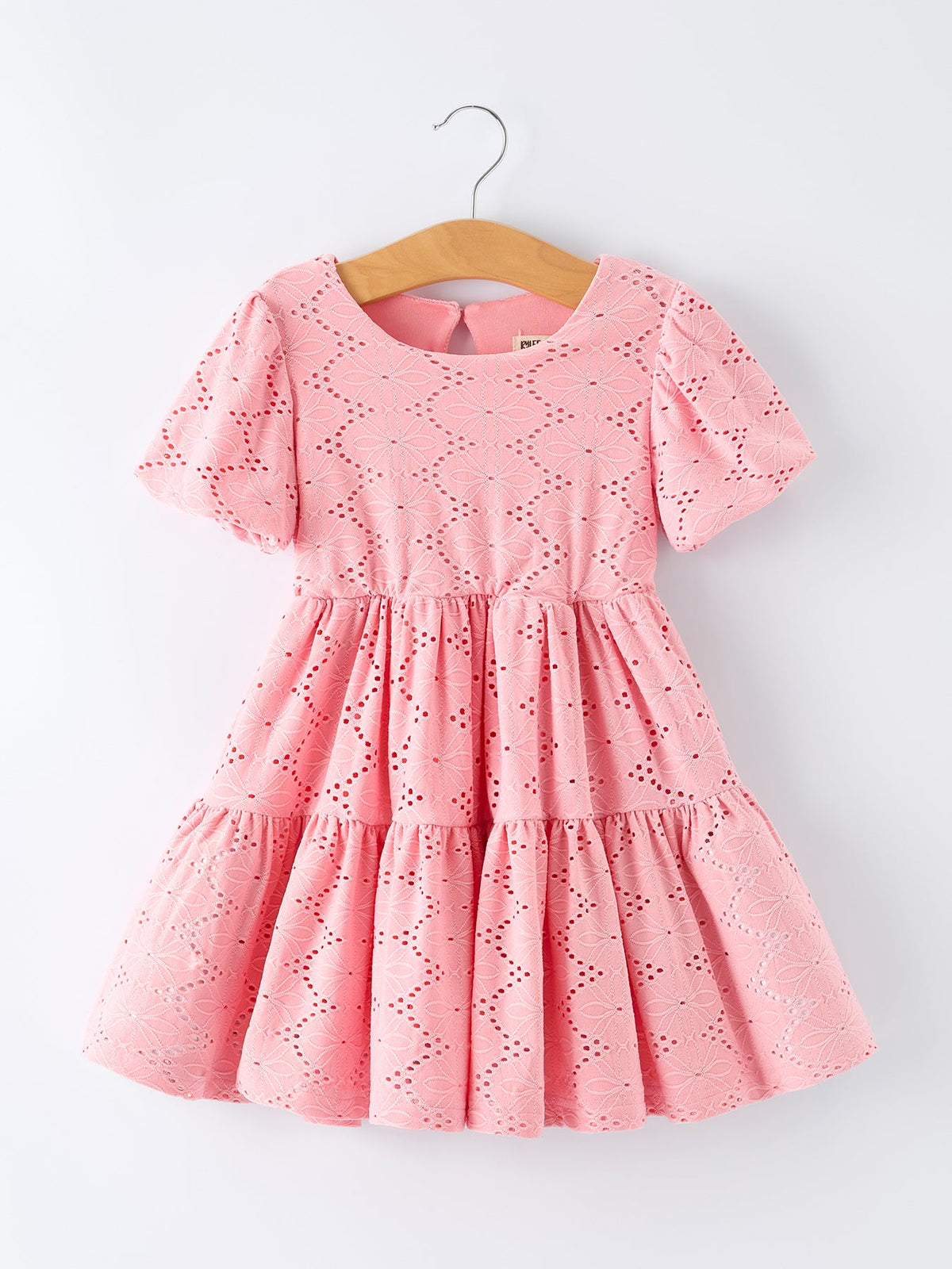 a pink dress on a swinger