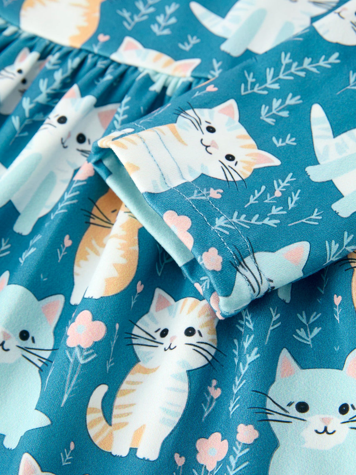 a blue skirt with cats on it