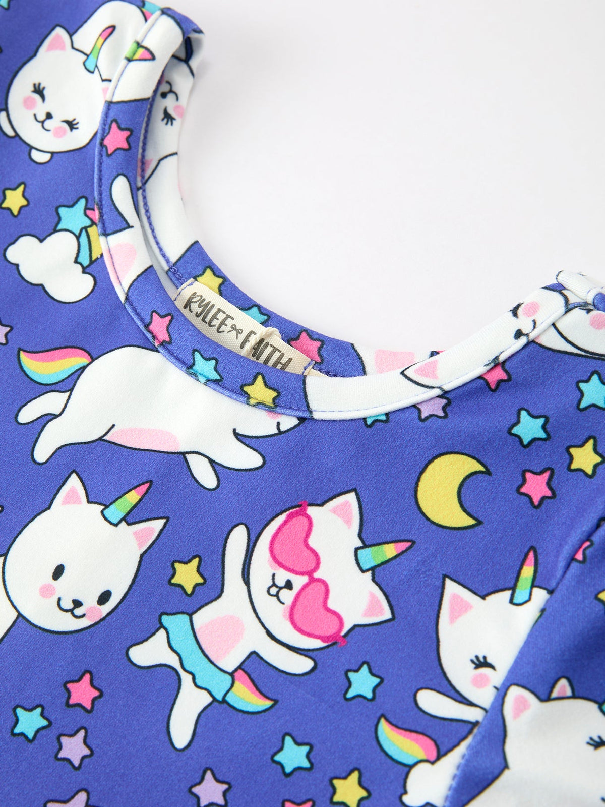 a blue shirt with cats and stars