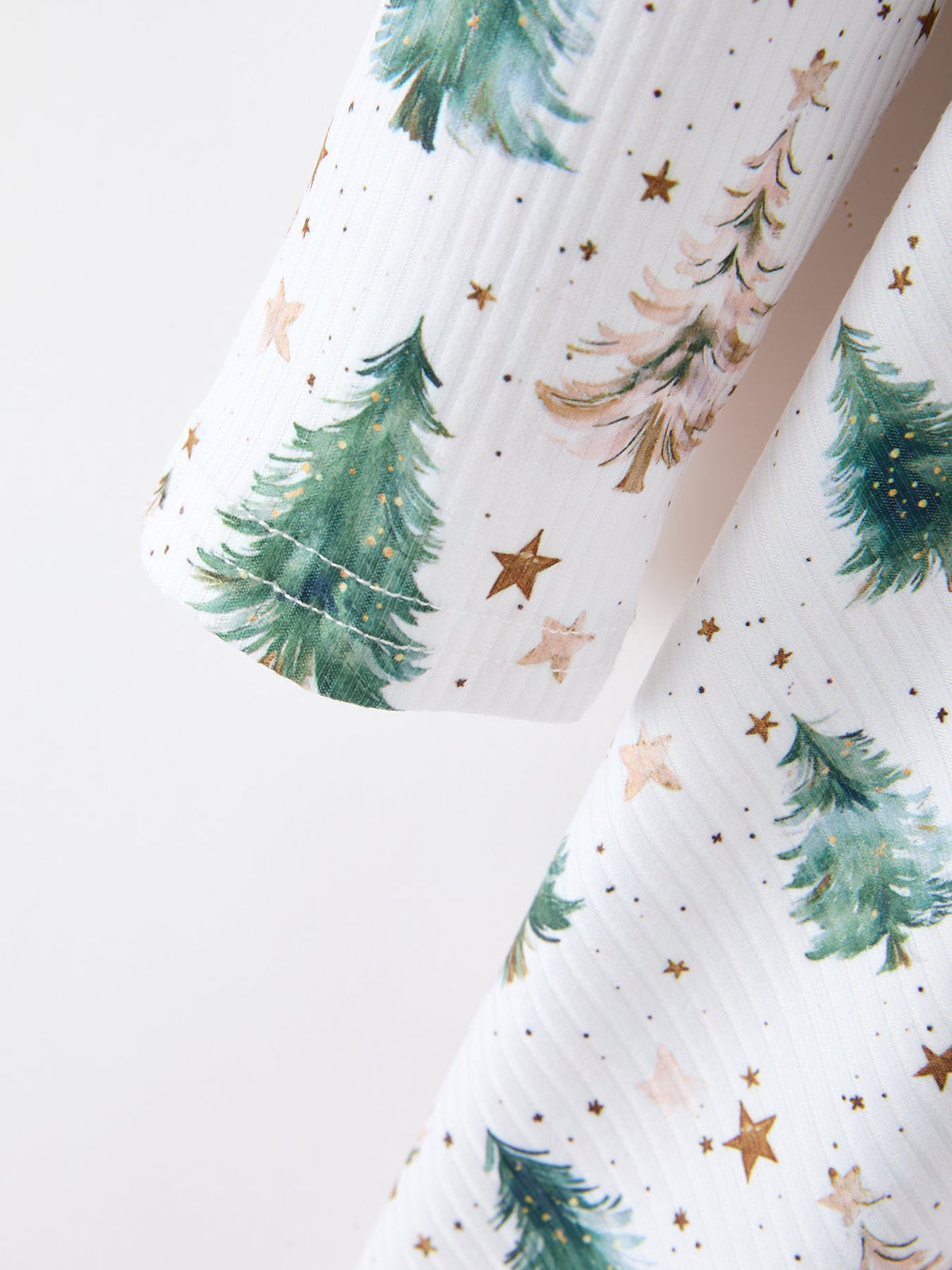 a white towel with trees and stars on it