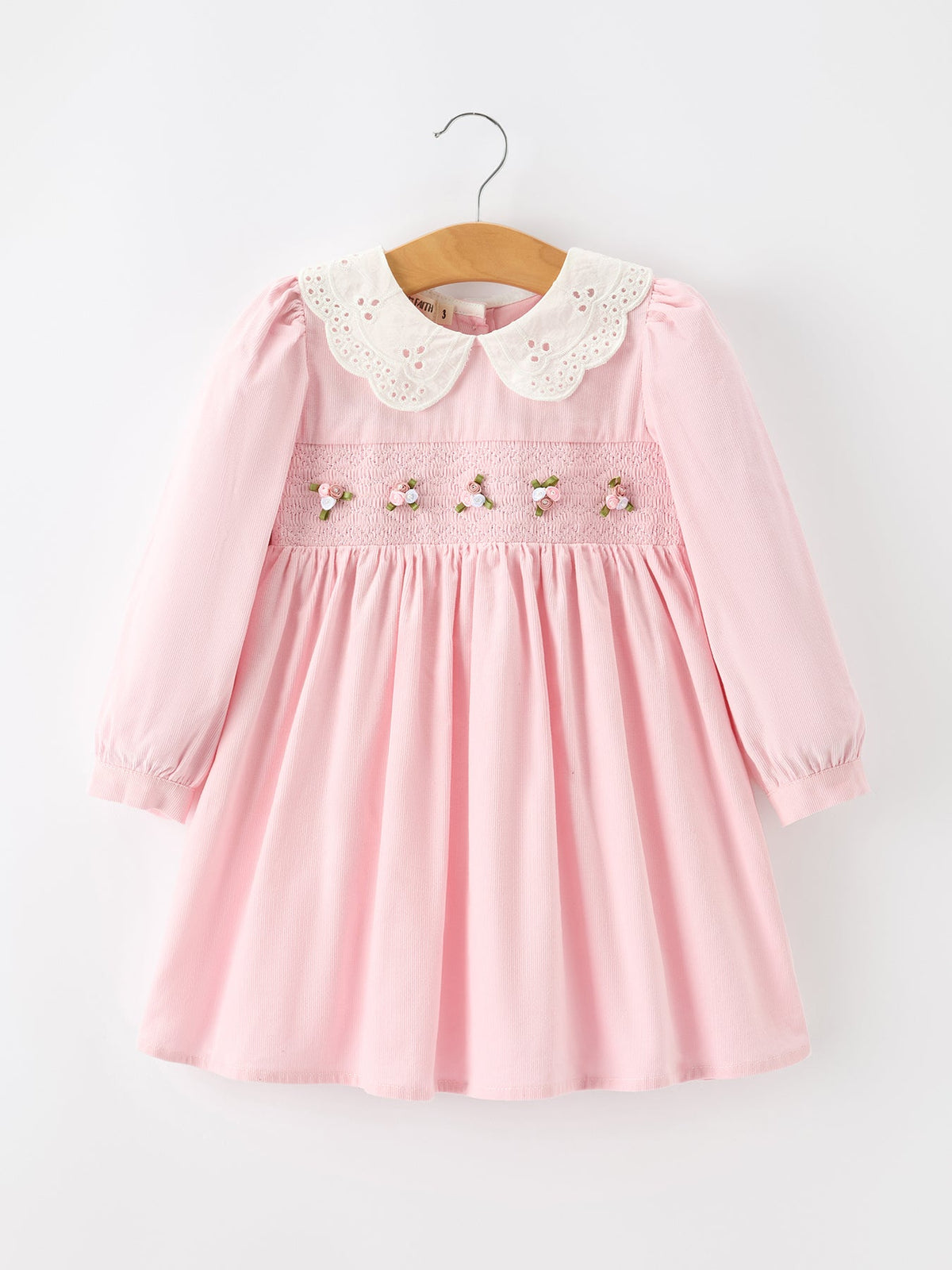 a pink dress on a swinger