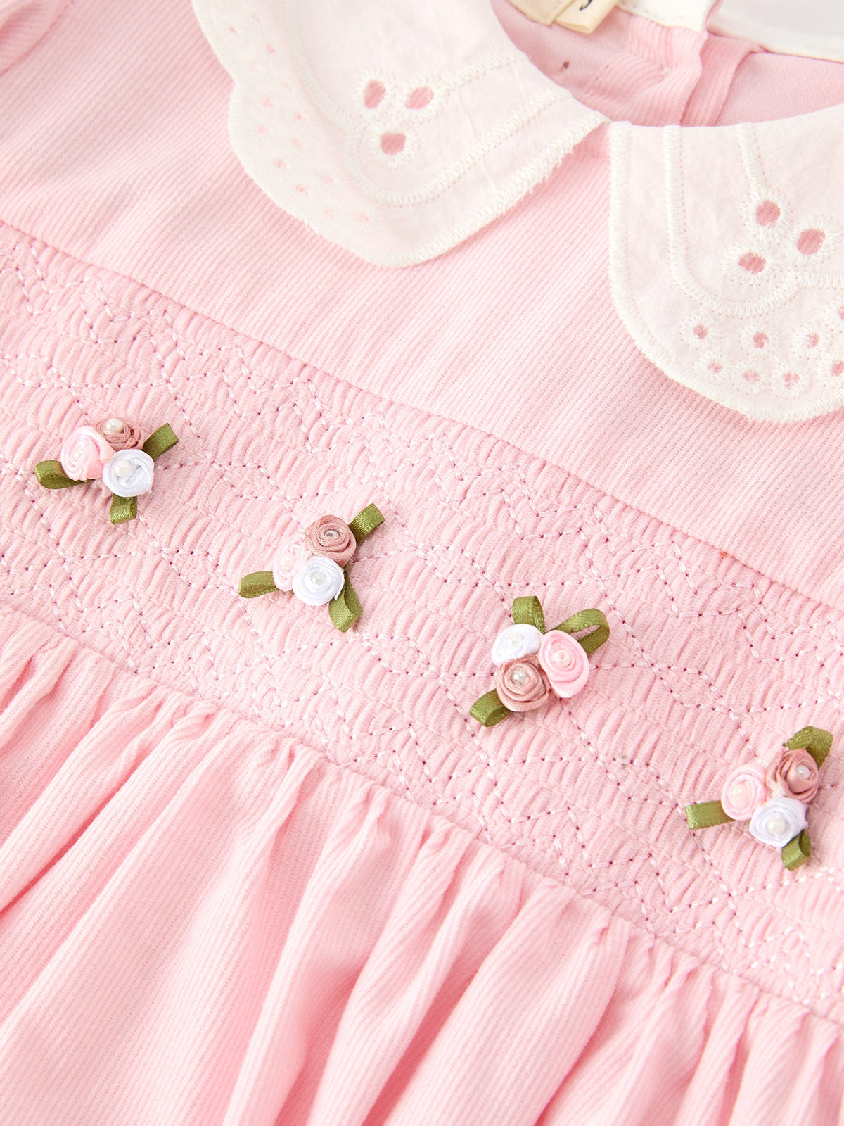 a close up of a pink dress