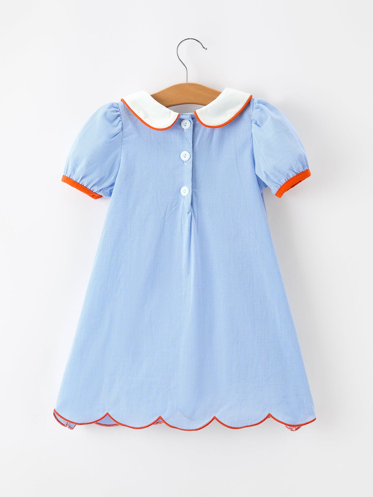 a blue and white checkered dress