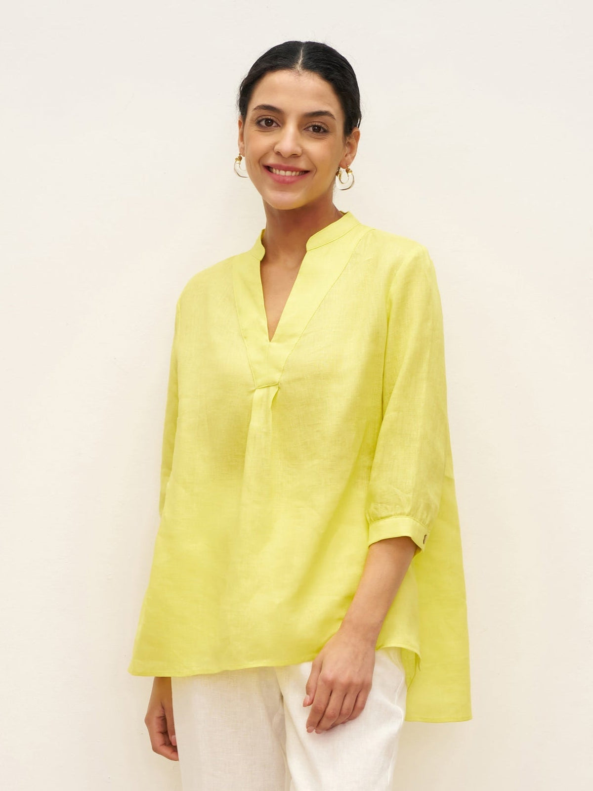 a woman in a yellow shirt
