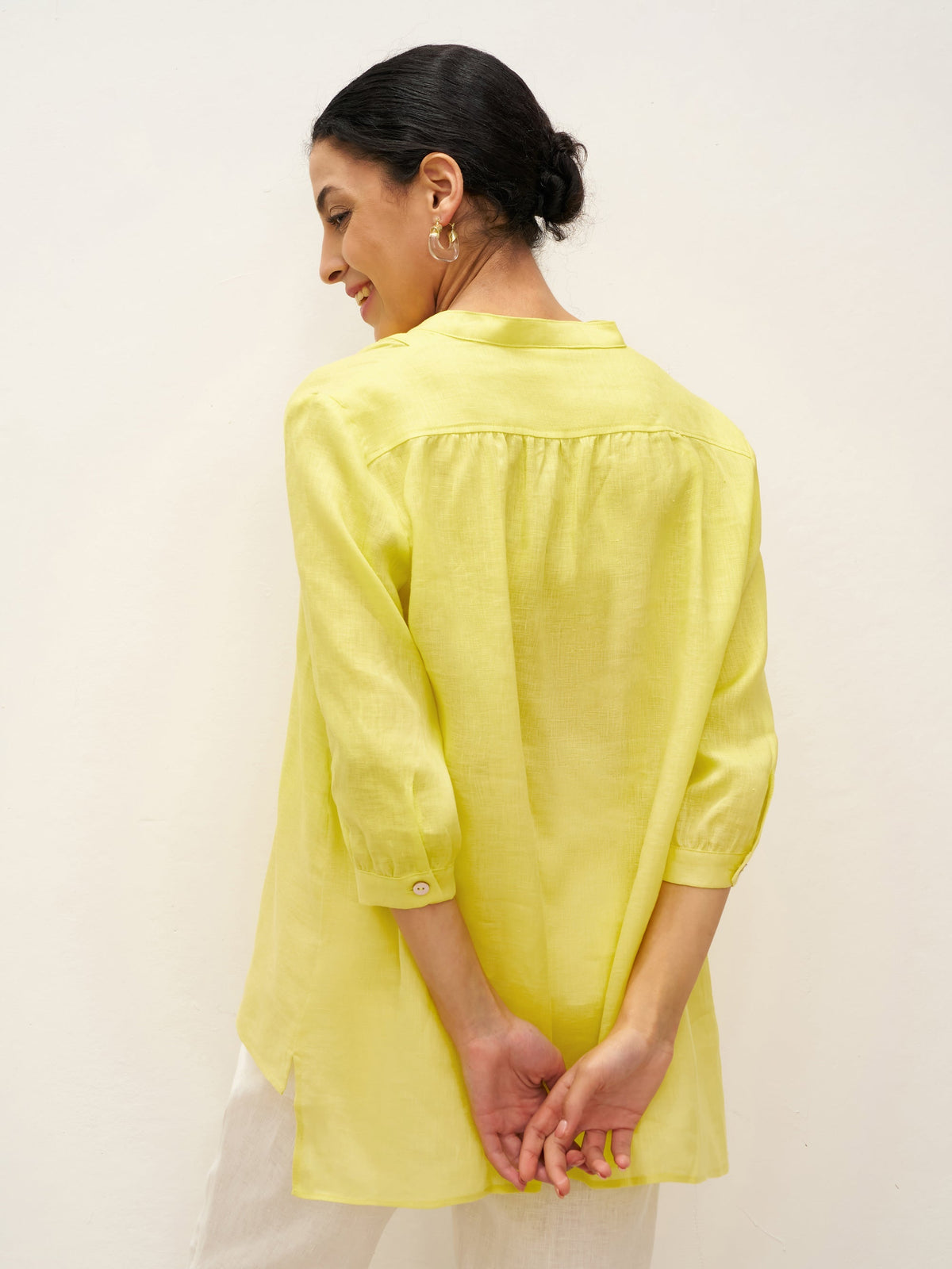 a woman in yellow shirt
