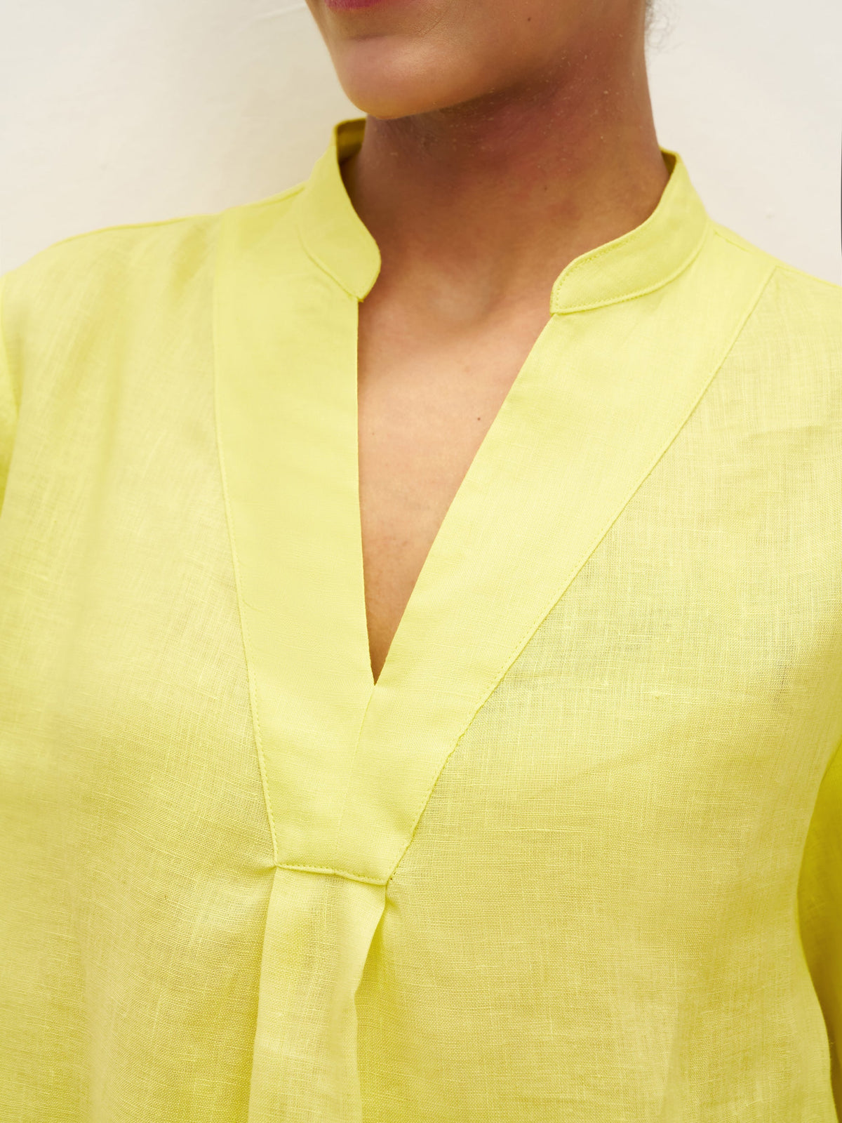 a person wearing a yellow shirt