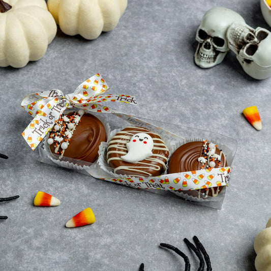 a box of chocolate candies with a bow