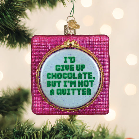 a christmas tree decoration with a quote