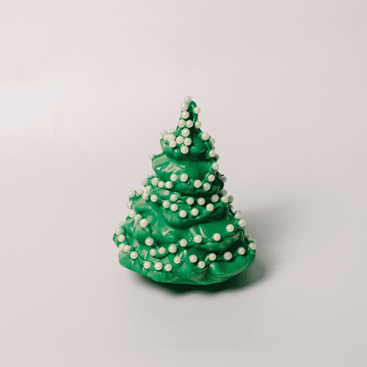a green christmas tree with white beads