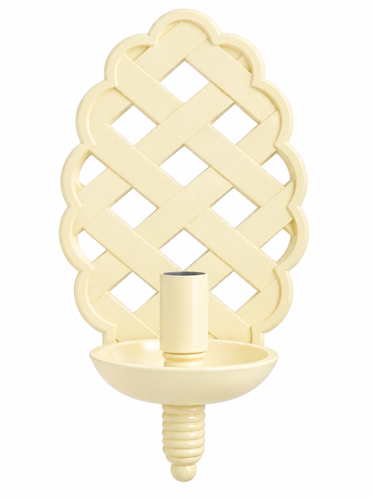 a white candle holder with a candle
