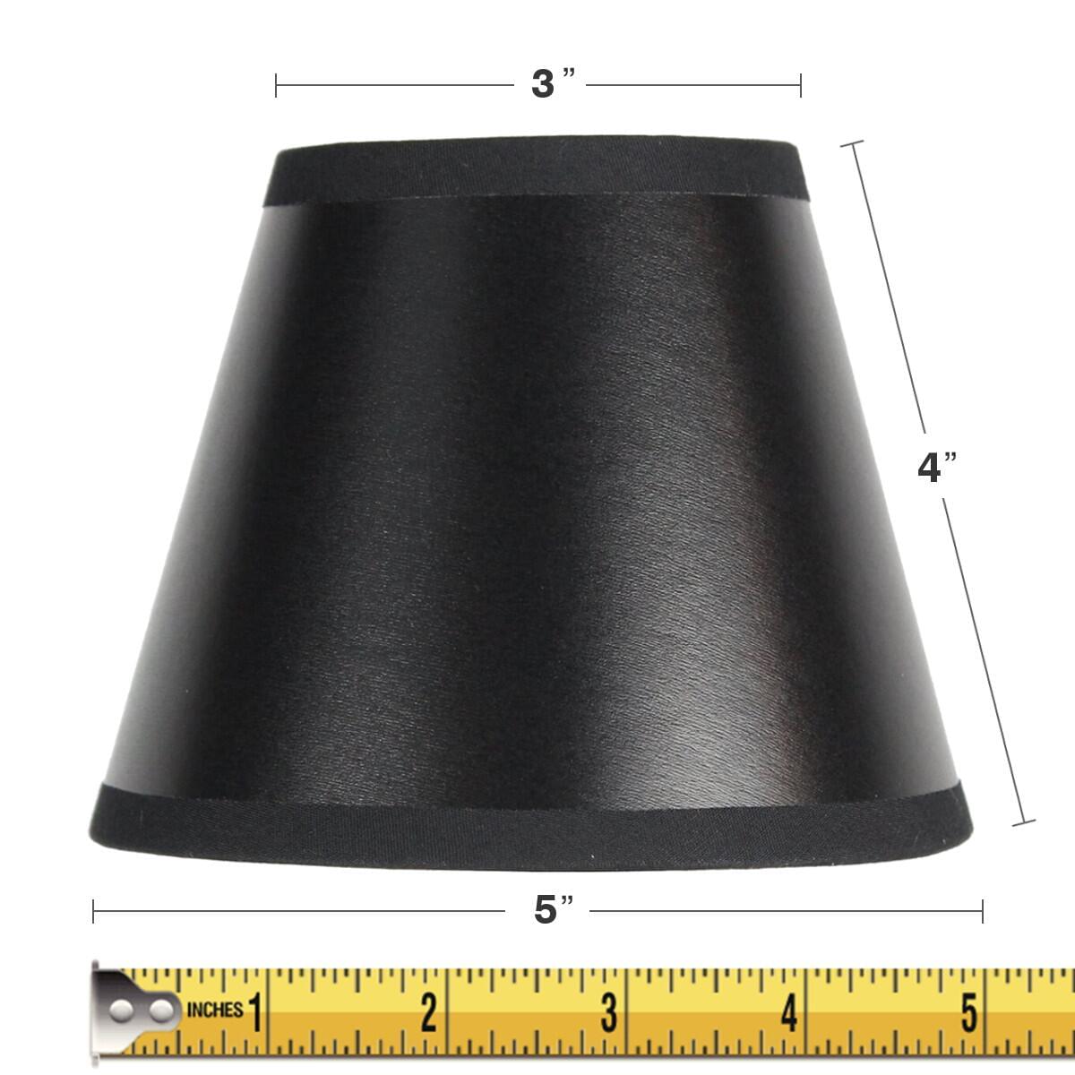 a black lamp shade with measuring tape