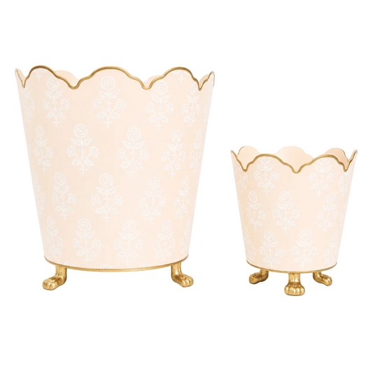 a pair of vases with gold legs