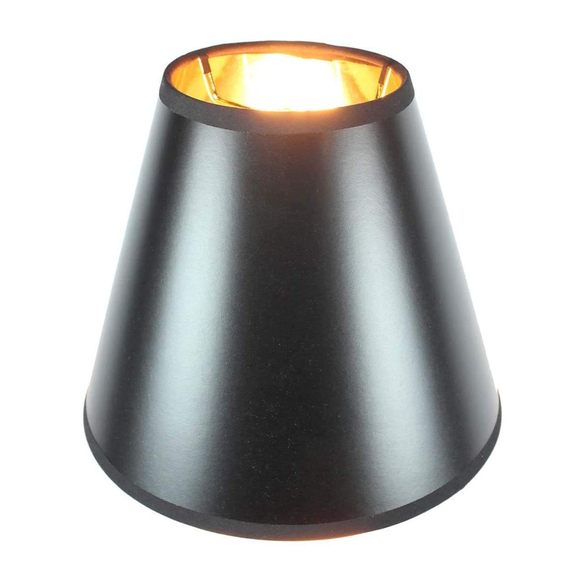 a black lamp shade with a yellow light inside