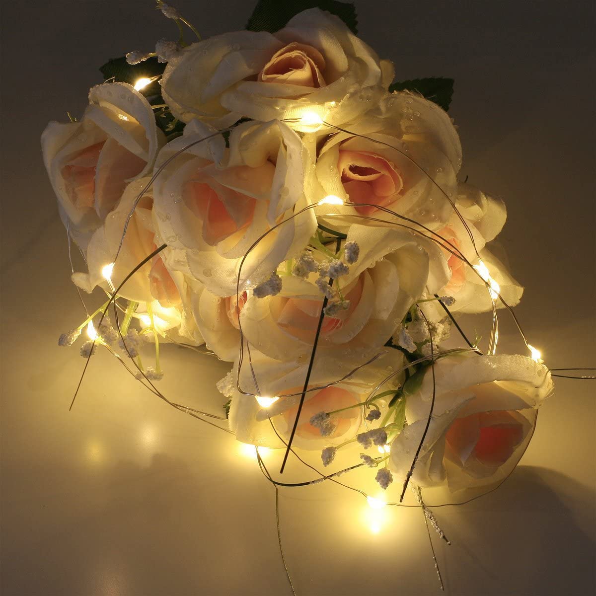 a bouquet of flowers with lights