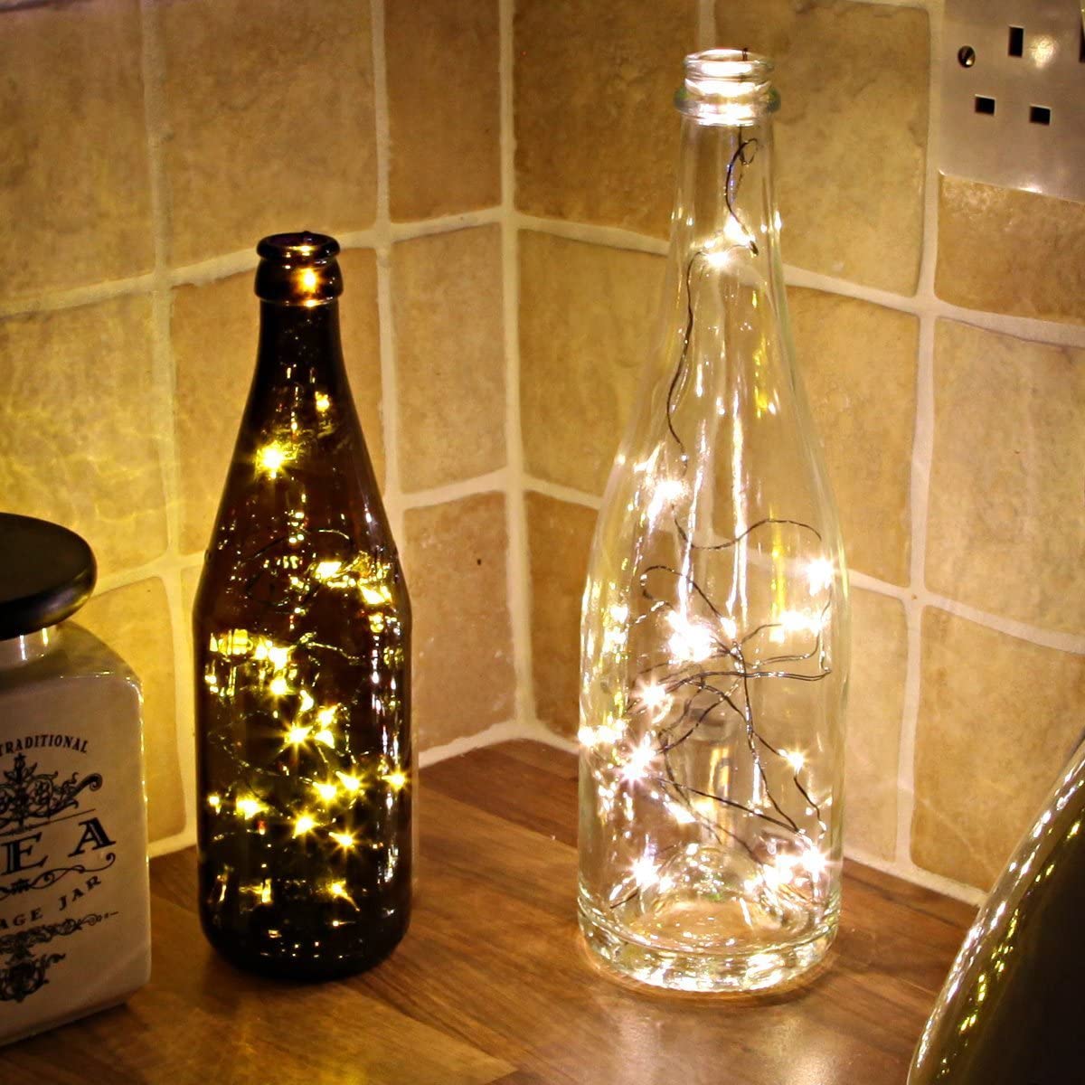 two bottles with lights on them