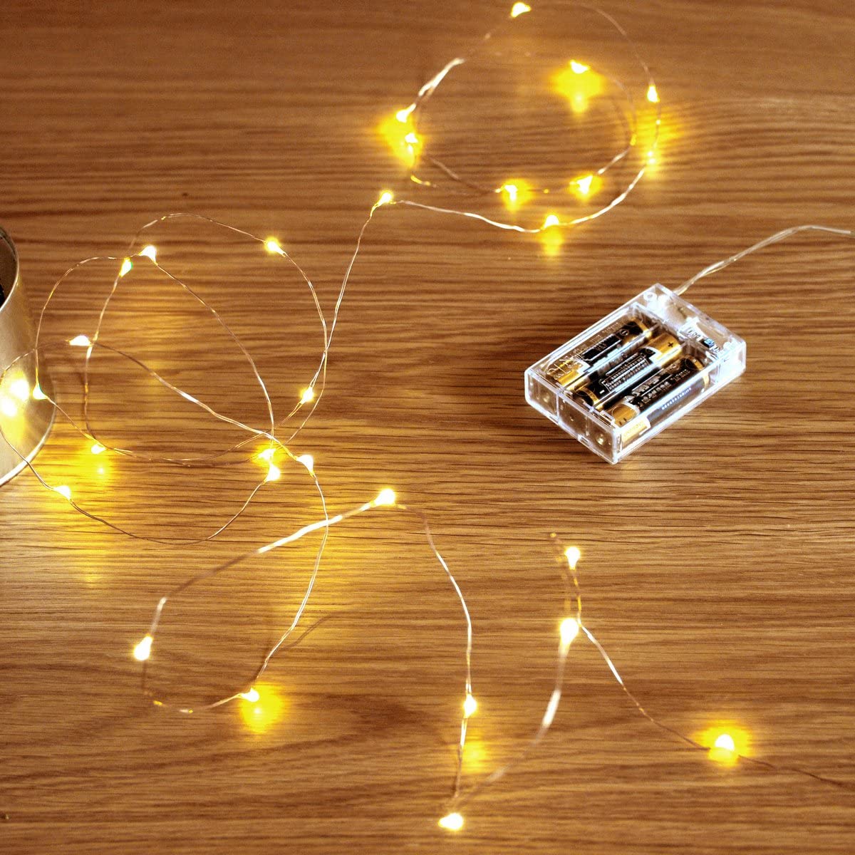 a string of lights next to a candle
