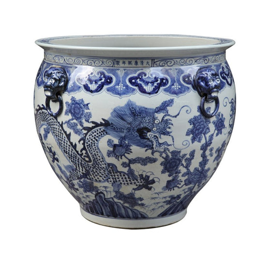 a blue and white vase with a dragon design