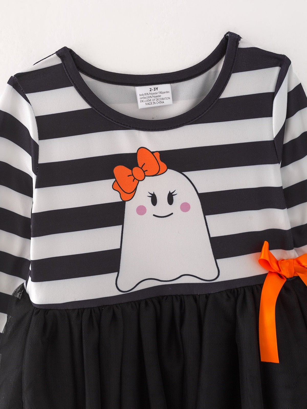 a black and white striped dress with a ghost on it