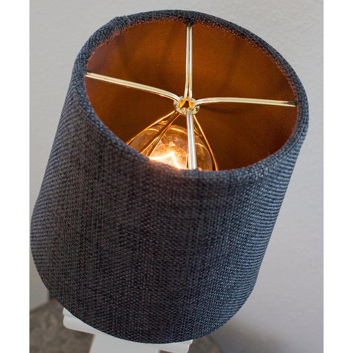 a lamp shade with a gold wire