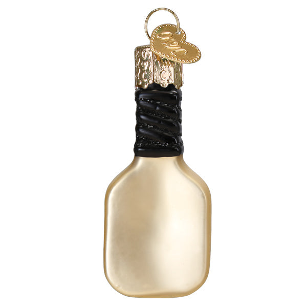 a gold bottle with a black ribbon