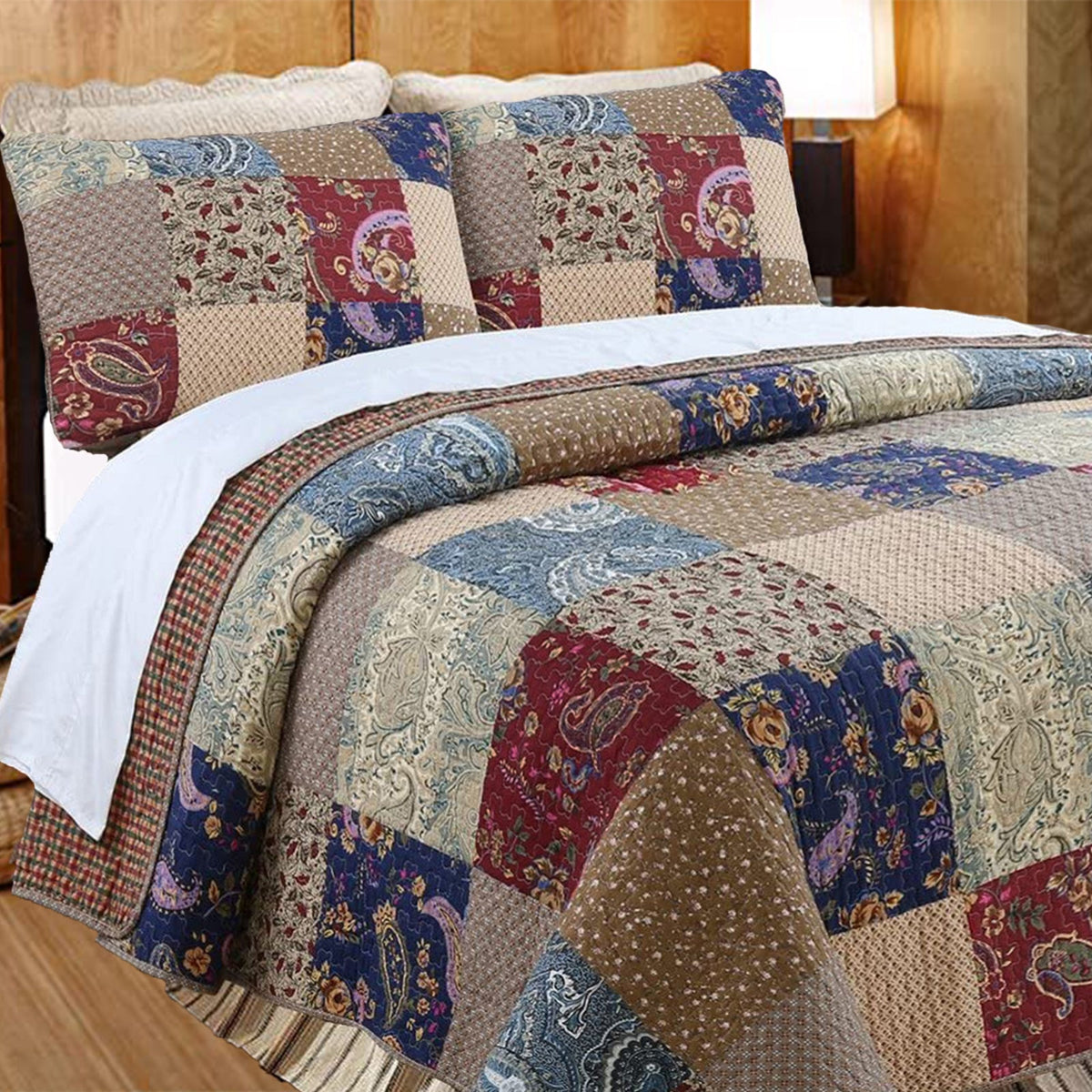 a bed with a quilt