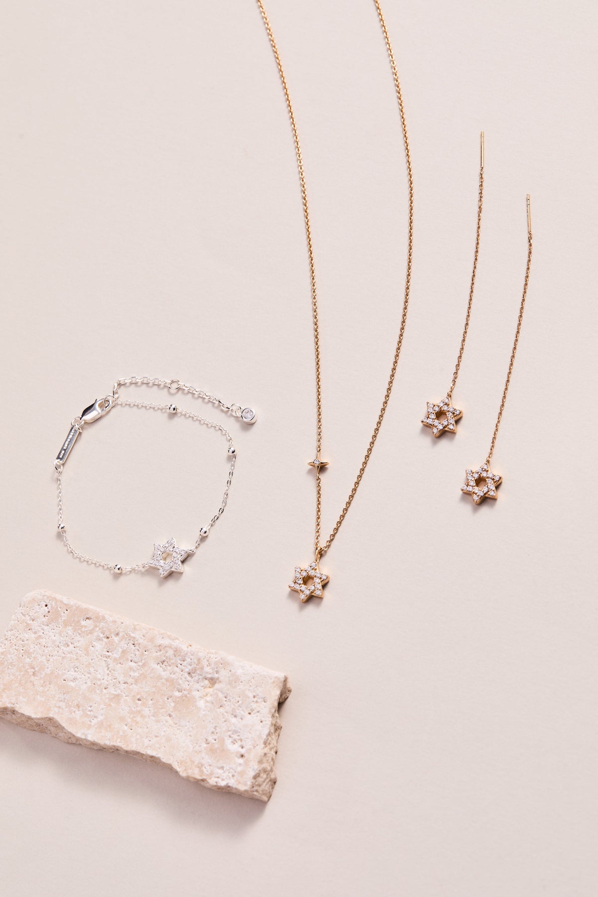 a group of jewelry on a white surface