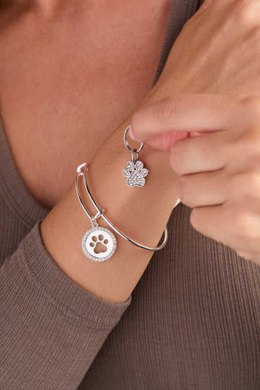 a person wearing a bracelet and necklace