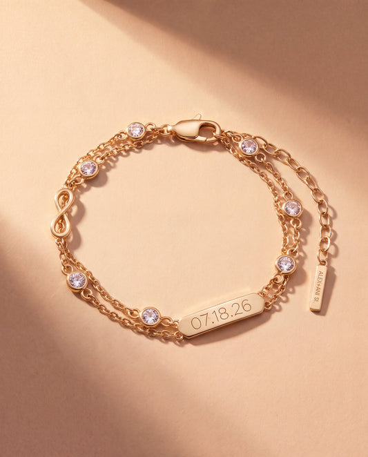 a gold bracelet with diamonds and a bar