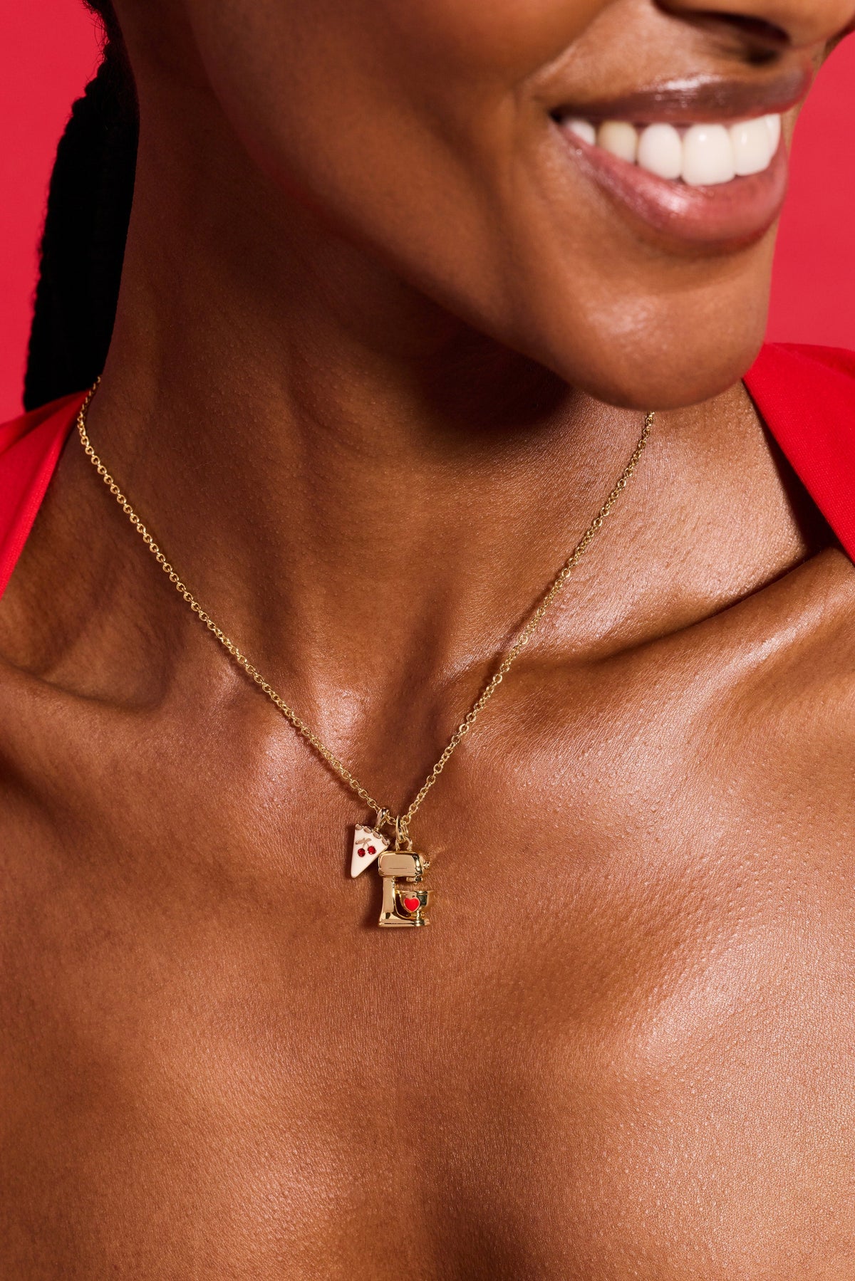 a woman wearing a gold necklace