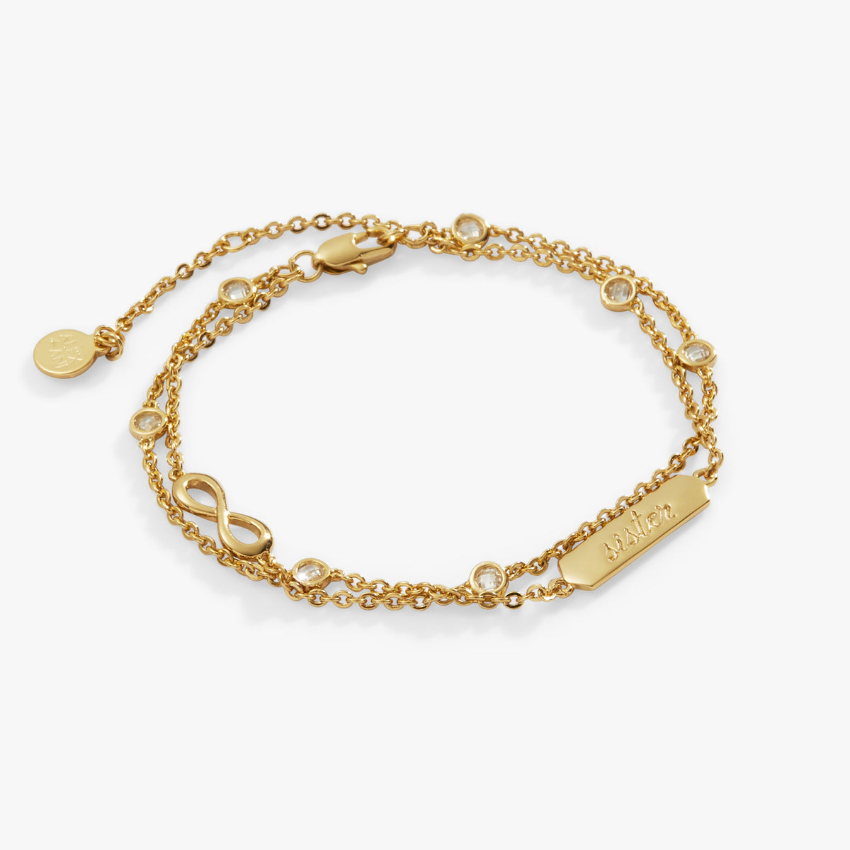 a gold bracelet with diamonds and a name plate