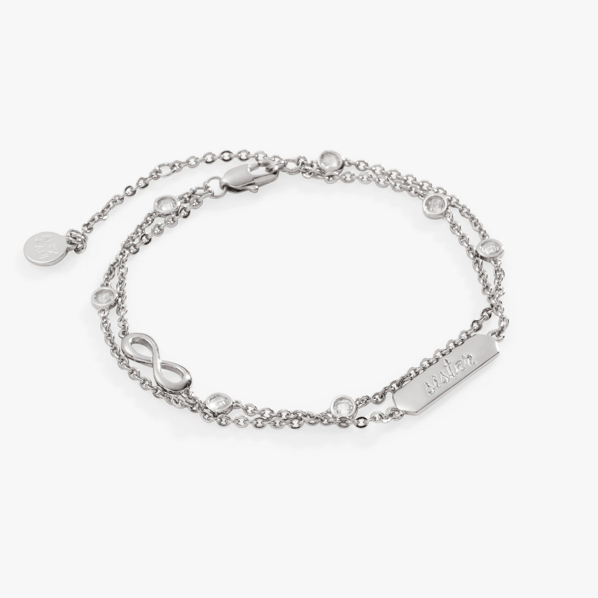 a silver bracelet with a name tag and diamonds