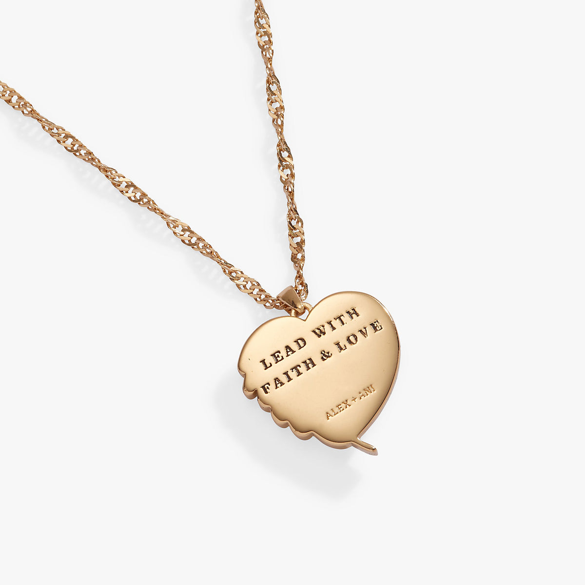 a gold heart necklace with a message on it