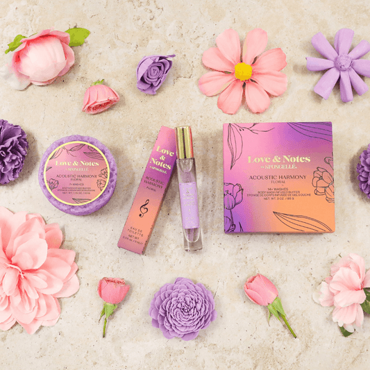 a group of flowers and perfumes