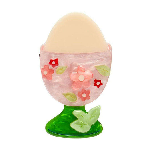 a pink and green egg shaped container