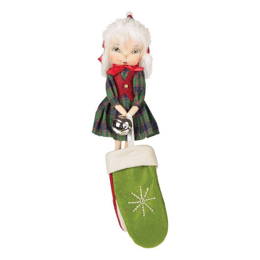 a doll with a green mitten