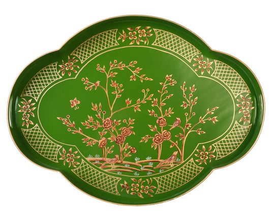 a green tray with gold and red floral design