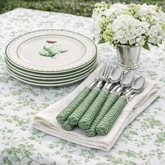a table with plates and silverware