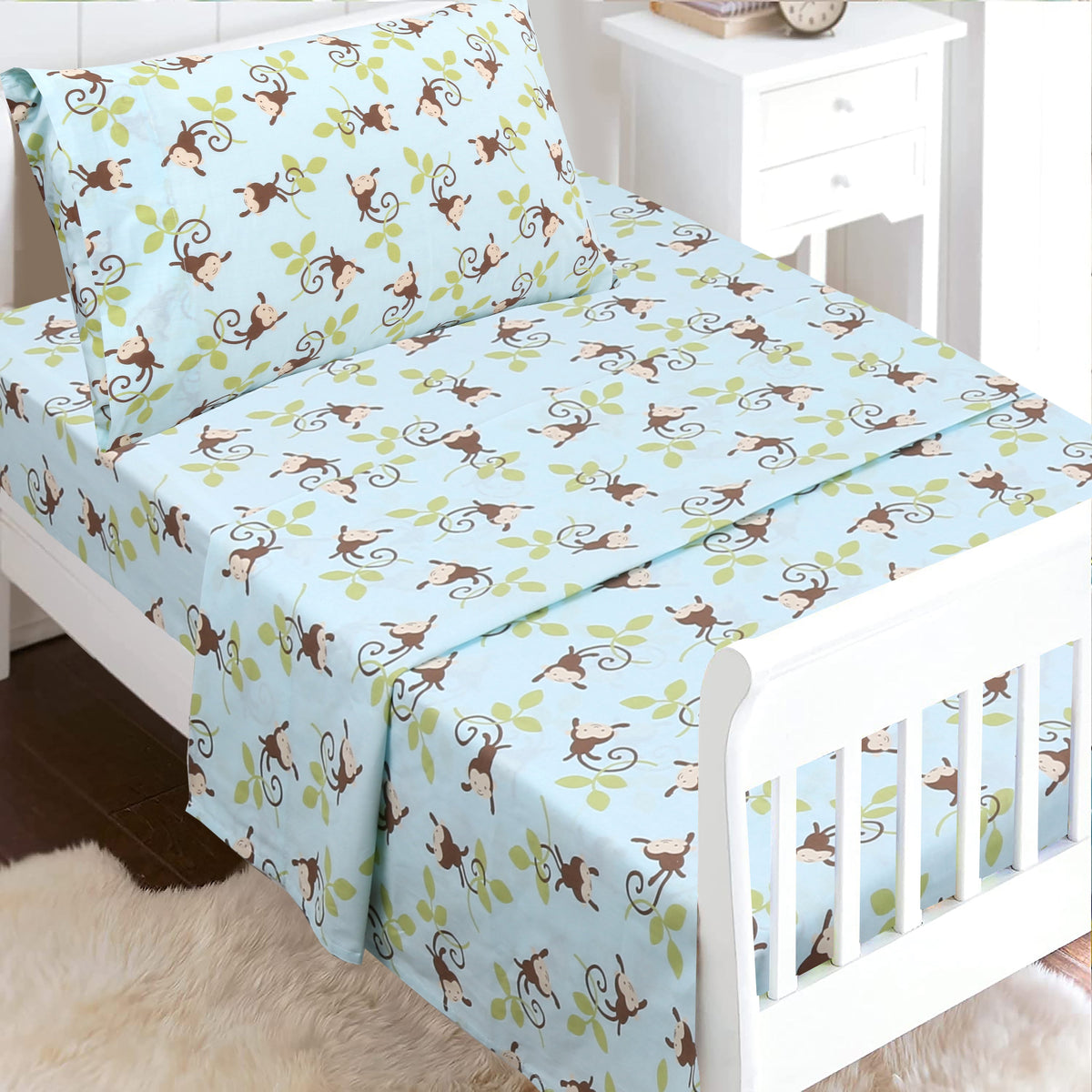 a bed with monkey design on it