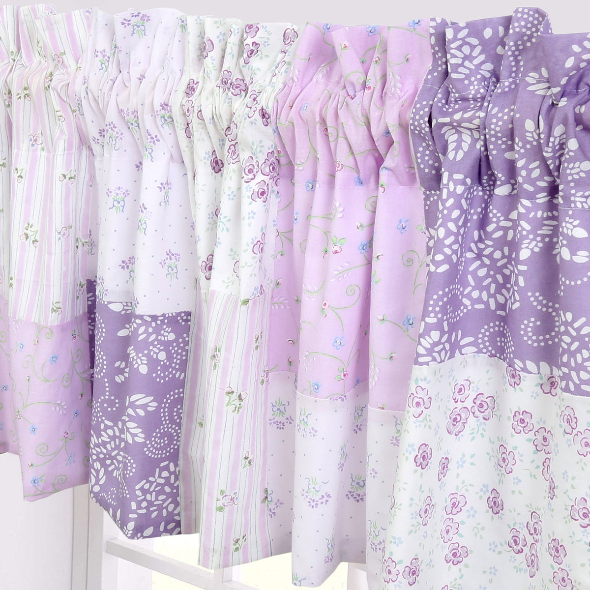a row of purple and white blankets