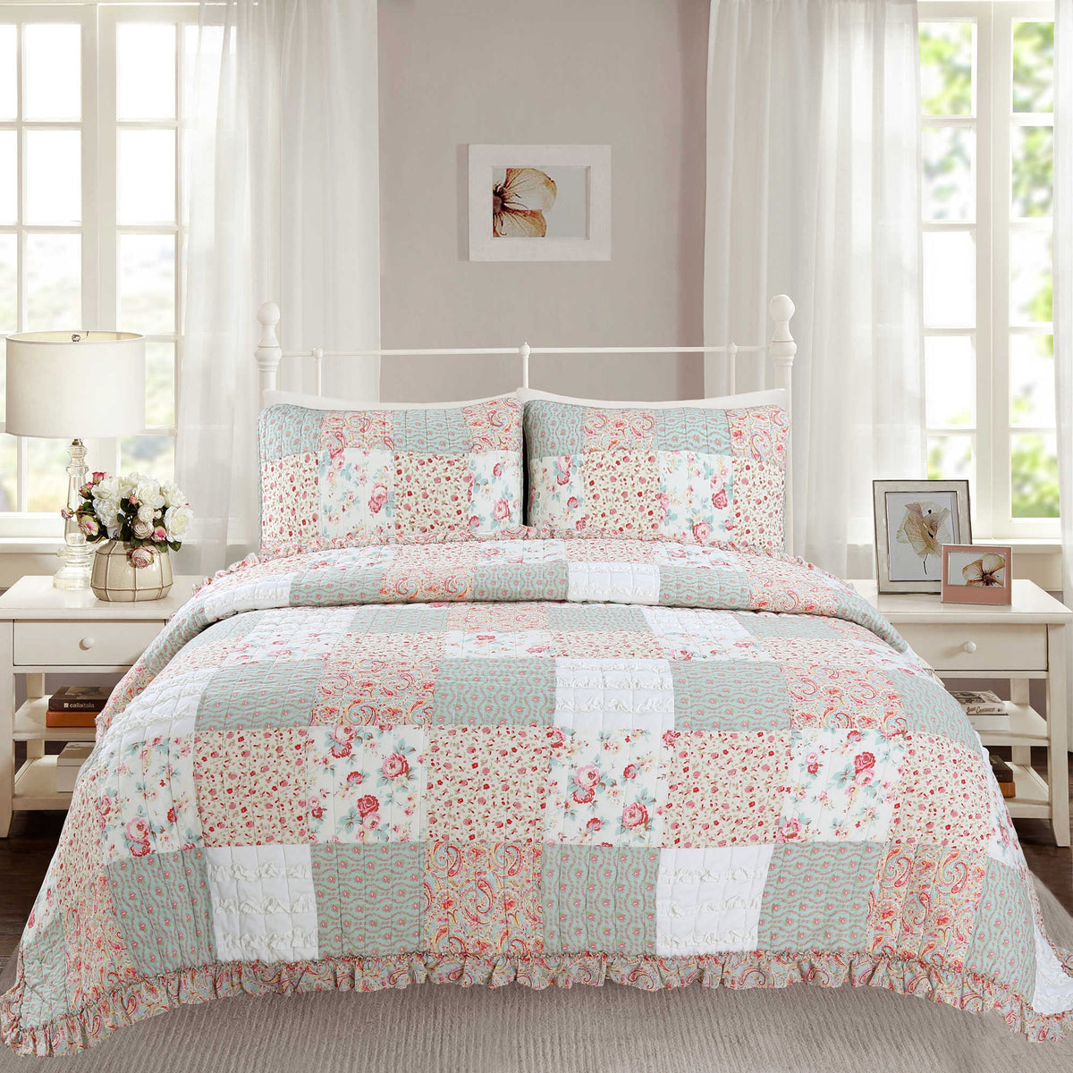 a bed with a quilt and pillows