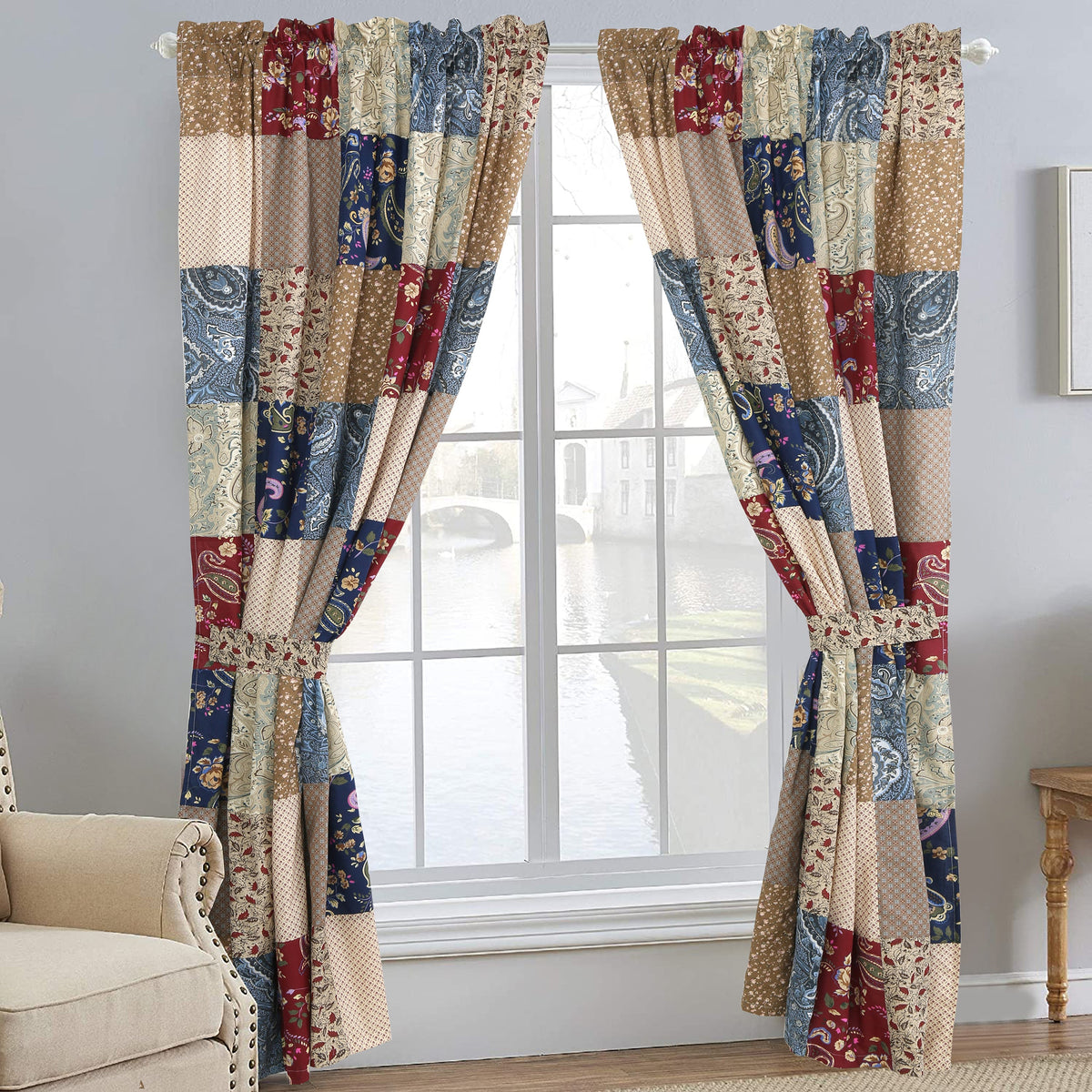 a window with a patchwork curtain