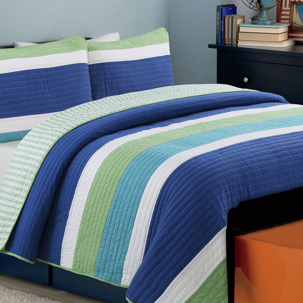 a bed with a striped bedding