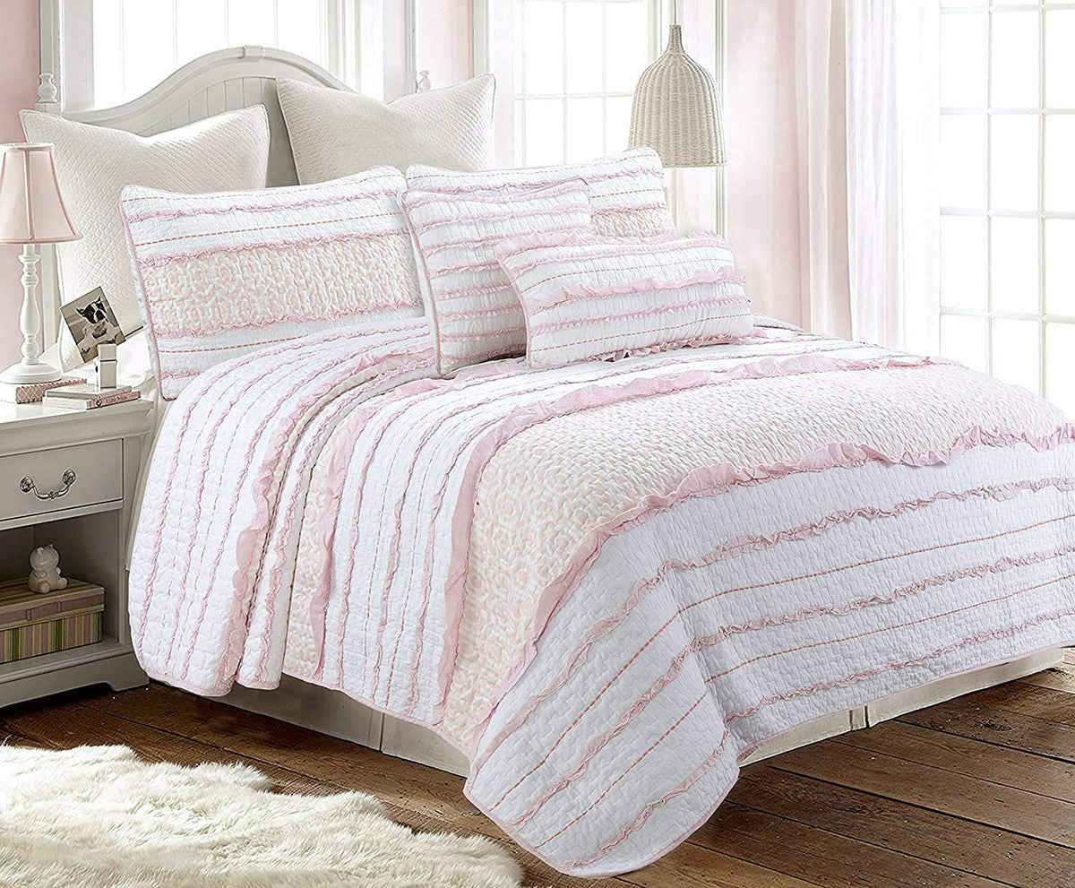a bed with pink and white bedding