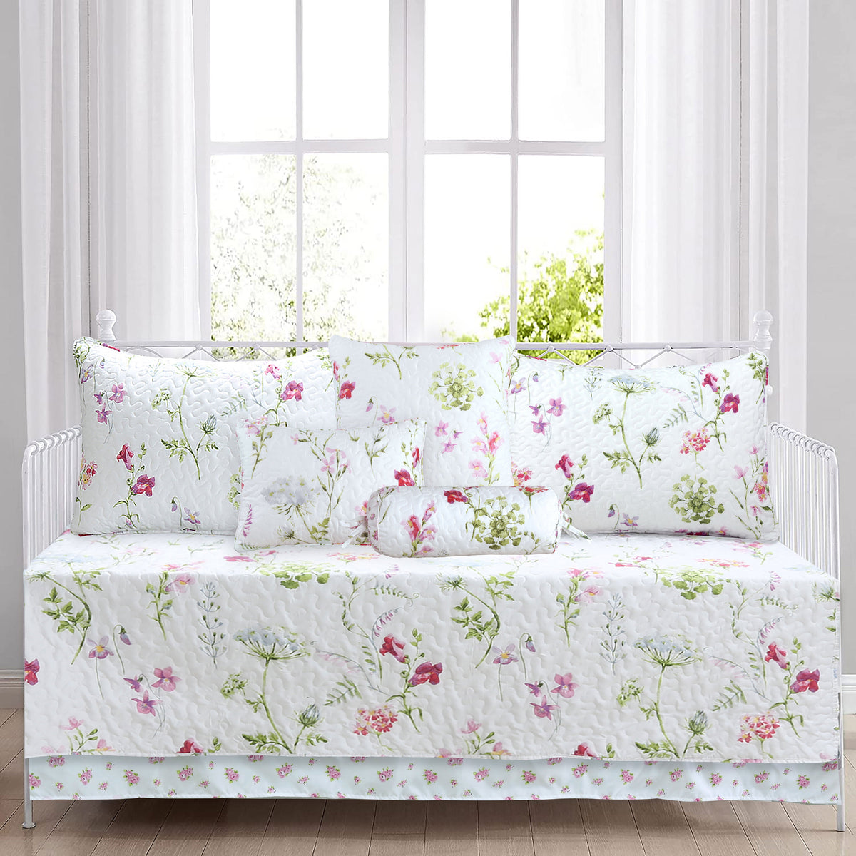 a bed with white sheets and pillows