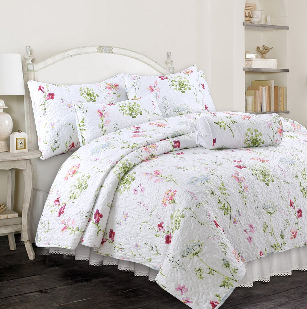 a bed with a white bedding and pillows