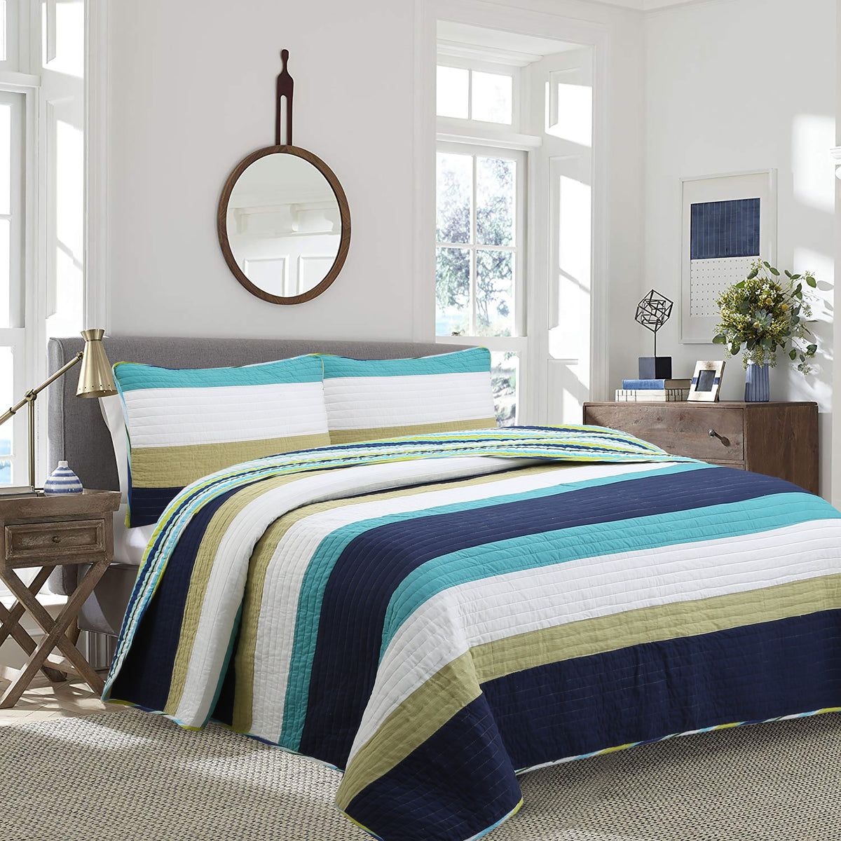 a bed with a striped bedding