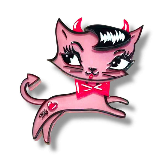 a pink cat pin with horns and a bow tie