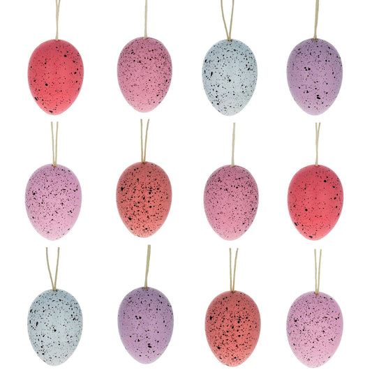 a group of colored eggs on a string